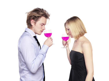 Young couple toasting with pink drink. Two people drinking. の写真素材