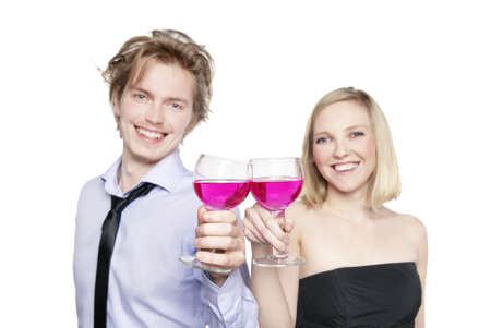 Young couple toasting with pink drink. Selective Focus. の写真素材