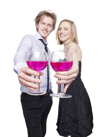 Young couple toasting with pink drink. Selective Focus. の写真素材