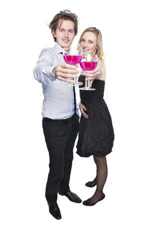 Young couple toasting with pink drink. Two people drinking. の写真素材