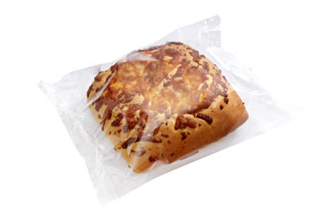 A studio photo of fresh bread in transparent plastic folie on a white background. 