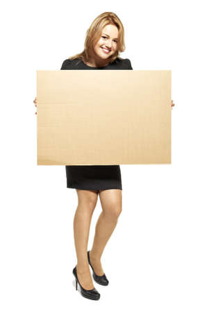 Attractive  Young Woman Holding Up a Blank Paperboard  Studio shot of woman isolated on white background の写真素材
