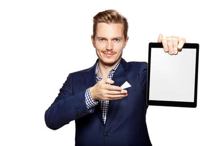 Portrait of a cheerful young businessman holding a blank digital tablet.の写真素材