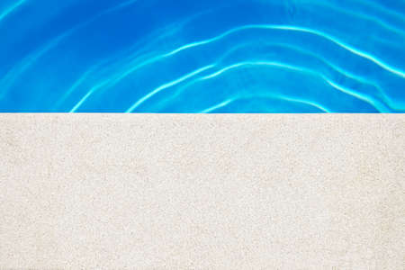 Swimming pool edge at the sunny day. Vacation background. Copy Spaceの写真素材