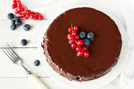 Homemade gluten free chocolate cake decorated with fresh berries