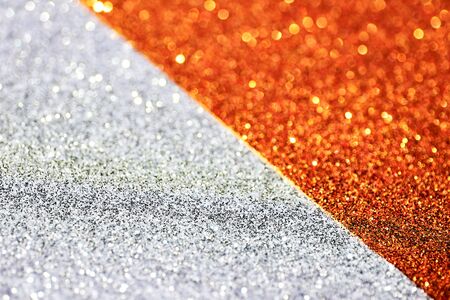 Silver and gold defocused glitter backround with place for text.