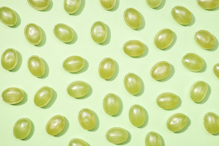 Green sweets minimalism set on pastel colorful backgroundの写真素材