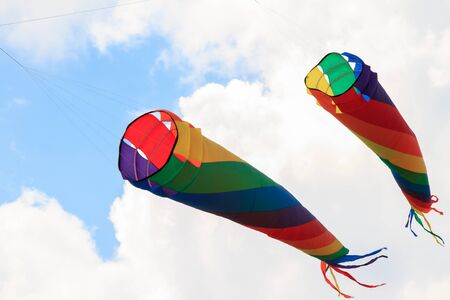 Colorful kites in the cloudy sky