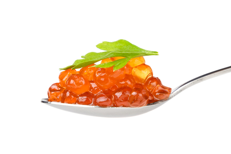 Spoon of red caviar isolated on whiteの写真素材