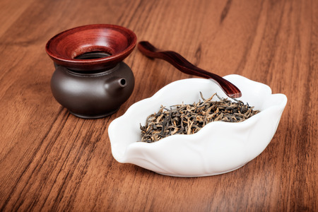 Group of chinese tea tools on brown wooden deskの写真素材