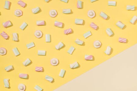 Sweet marshmallows minimalism set on pastel colorful backgroundの写真素材