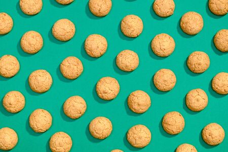 Sweet cookies flat lay pattern on dark green backgroundの写真素材