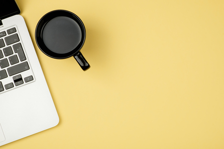 Minimal workplace with notebook and copy space on pastel background. Top view. Flat lay.の写真素材