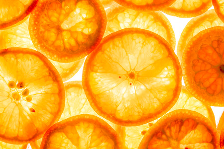 Mandarin citrus fruit slices background top viewの写真素材