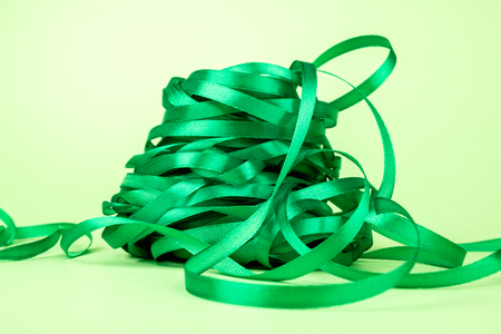 Closeup of ribbon roll over colorful background isolatedの写真素材