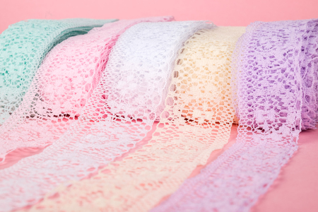 Closeup of ribbon roll over colorful background isolatedの写真素材