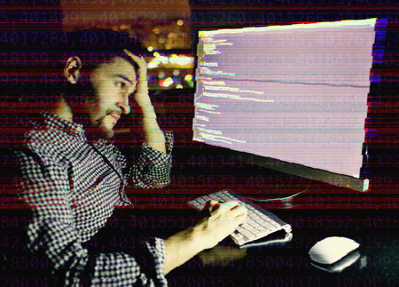 Man working with computer. Program development concept. Glitch effect added