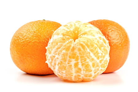 Ripe mandarines closeup isolated on white backgroundの写真素材
