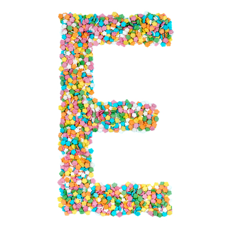 English alphabet letters, numerals and symbols made of little candies isolated on white backgroundの写真素材