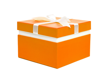 Orange gift box with ribbon bow. Holiday present. Isolated on white backgroundの写真素材