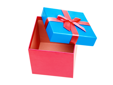 Red and blue gift box with ribbon bow. Holiday present. Isolated on white backgroundの写真素材