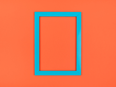 Empty picture frame on textured pastel colored background. Abstract minimalist compositionの写真素材