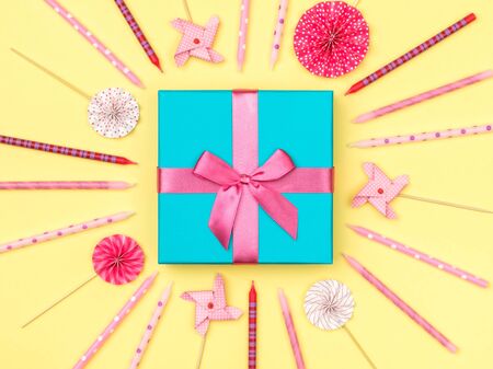 Gift box with party items on colorful background. Flat layの写真素材