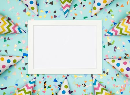 Blank card with colorful party items on a colorful backgroundの写真素材