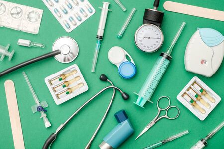 Flat lay of medical tools on colored background. Healthcare insurance concept. Table top view...
