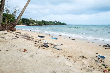 Spilled plastic garbage on the beach. Environmental pollution and ecological problem conceptの写真素材