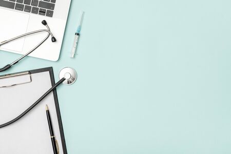 Modern medicine workplace with laptop at doctor's desk. Copy space, view from the top