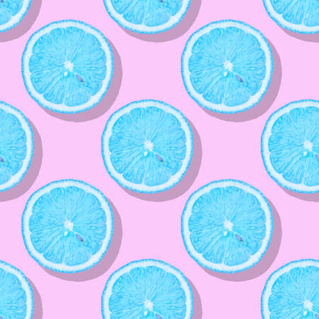Lemon seamless pattern. Slices of lemon with blue pulp lying on a color background. Pop art style...