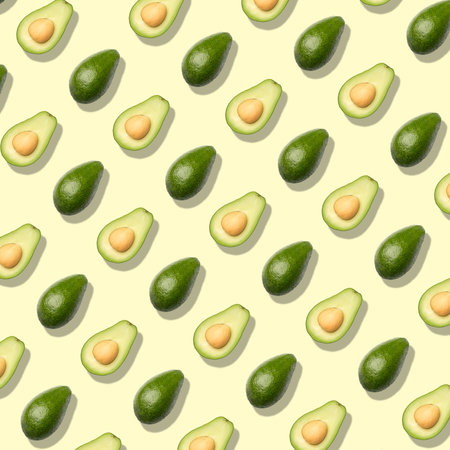 Pattern with avocado. Abstract background. Avocado on the yellow backgroundの写真素材