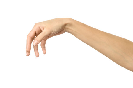Hand picking, holding, grabbing or reaching. Woman hand with french manicure gesturing isolated on white background. Part of seriesの写真素材