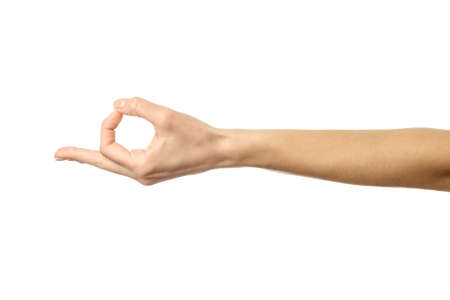 Ok sign. Woman hand with french manicure gesturing isolated on white background. Part of seriesの写真素材