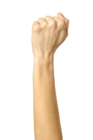 Hand clenched in a fist. Vertical image. Woman hand with french manicure gesturing isolated on white background. Part of seriesの写真素材