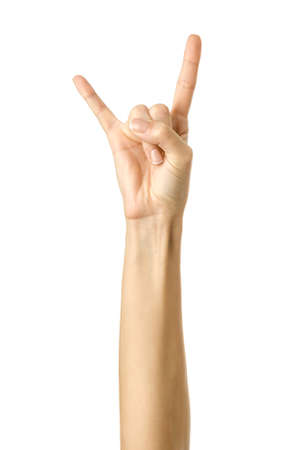 Rock and roll! Woman hand with french manicure gesturing isolated on white background. Part of seriesの写真素材