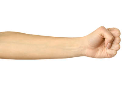 Hand clenched in a fist. Horizontal image. Woman hand with french manicure gesturing isolated on white background. Part of seriesの写真素材