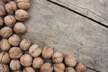 Natural walnuts in a wooden shell. Photographed close-up.の写真素材