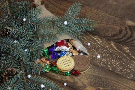 Bag of sweets and Christmas treeの写真素材