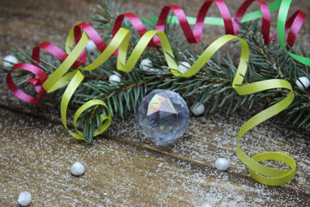 Christmas tree and a glass bowl on wooden boardsの写真素材