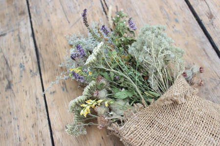 Multi-colored dried herbs against the background of boardsの写真素材