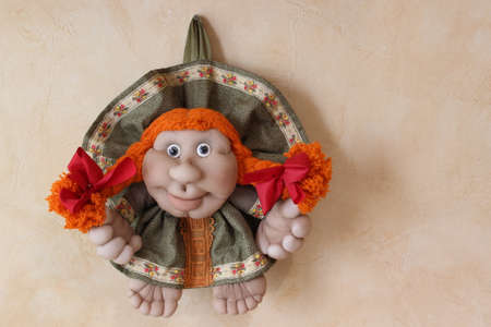 Children's handmade baby doll with red hairの写真素材