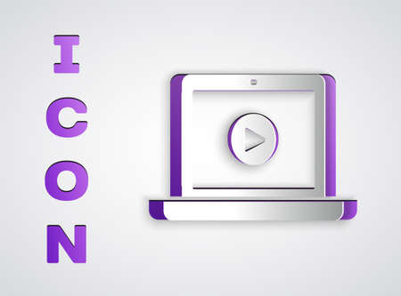 Paper cut Online play video icon isolated on grey background. Laptop and film strip with play sign. Paper art style. Vector Illustrationのイラスト素材
