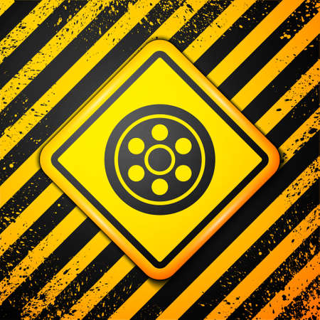 Black Alloy wheel for a car icon isolated on yellow background. Warning sign. Vector Illustrationのイラスト素材