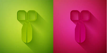 Paper cut Scissors icon isolated on green and pink background. Cutting tool sign. Paper art style. Vector Illustrationのイラスト素材