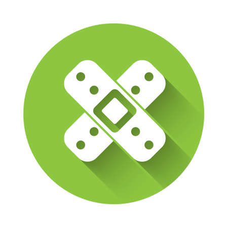 White Crossed bandage plaster icon isolated with long shadow. Medical plaster, adhesive bandage, flexible fabric bandage. Green circle button. Vector Illustrationのイラスト素材