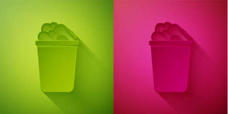 Paper cut Bucket with soap suds icon isolated on green and pink background. Bowl with water. Washing clothes, cleaning equipment. Paper art style. Vectorのイラスト素材