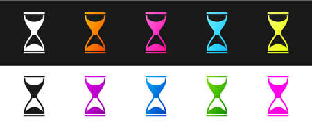 Set Old hourglass with flowing sand icon isolated on black and white background. Sand clock sign....