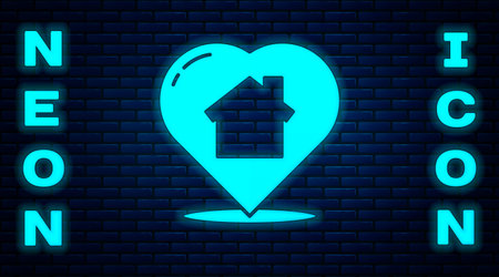 Glowing neon House with heart shape icon isolated on brick wall background. Love home symbol. Family, real estate and realty. Vector Illustrationのイラスト素材